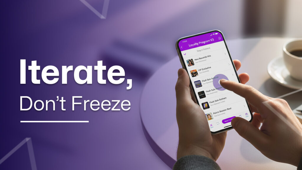 A person using a mobile app to manage a loyalty program, with the text ‘Iterate, Don’t Freeze’ on a purple background.