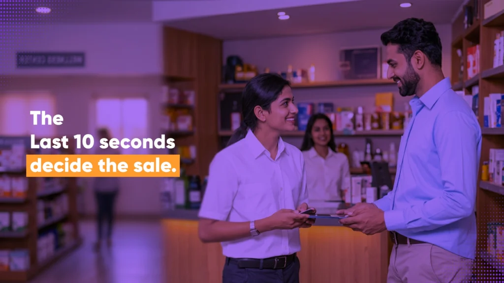 Indian retail staff member recommending a product to a customer at the counter, illustrating how spiff channel incentive models influence frontline sell-through decisions in the last seconds of a sale.
